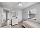 Guest bedroom featuring a neutral color scheme, a large window, and tile floors at 1039 23Rd St, Sarasota, FL 34234