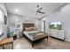 Bright bedroom featuring a ceiling fan, tiled floors and large windows that provide natural light at 1039 23Rd St, Sarasota, FL 34234