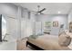 Spacious bedroom with vaulted ceilings, modern ceiling fan, tile floors, and ample natural light at 1039 23Rd St, Sarasota, FL 34234