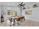 Elegant dining room with modern table, chairs, and sliding glass doors to patio at 1039 23Rd St, Sarasota, FL 34234