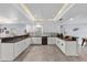 Bright kitchen with white cabinets, granite countertops and tiled floors at 1039 23Rd St, Sarasota, FL 34234
