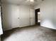 Bedroom with carpeted floor and white doors with white trim at 10404 Hawk Ct, Riverview, FL 33578