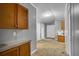 Hallway leading to bedrooms with neutral walls, cabinets, and carpeted floors at 10404 Hawk Ct, Riverview, FL 33578