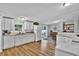Functional kitchen with ample counter space, white cabinetry, and an adjacent dining area, great for entertaining at 10404 Hawk Ct, Riverview, FL 33578