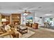 Spacious living room featuring a brick fireplace and comfortable seating at 10404 Hawk Ct, Riverview, FL 33578