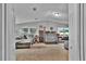 Spacious living room featuring couches and large windows, neutral walls and carpeting at 10404 Hawk Ct, Riverview, FL 33578