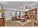 Inviting living room with a brick fireplace, comfortable seating, and lots of natural light at 10404 Hawk Ct, Riverview, FL 33578