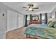 Comfortable main bedroom with large closet space, neutral carpeting, and an abundance of natural light at 10404 Hawk Ct, Riverview, FL 33578