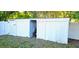 Home features a large, white exterior shed at 10404 Hawk Ct, Riverview, FL 33578