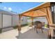 A backyard with a covered patio, grill, and seating area for outdoor entertaining at 12442 Curry Dr, Spring Hill, FL 34609