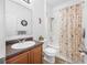 Bathroom featuring a single sink vanity and shower with ocean themed curtain at 12442 Curry Dr, Spring Hill, FL 34609