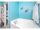 Bathroom featuring a soaking tub and separate room for the toilet at 12442 Curry Dr, Spring Hill, FL 34609
