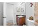 Bathroom featuring a single sink vanity and toilet at 12442 Curry Dr, Spring Hill, FL 34609