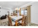 Dining area includes a wood table with six chairs and access to the outdoor pool area at 12442 Curry Dr, Spring Hill, FL 34609
