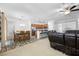 Open-concept living room with view of kitchen and dining area with bright, neutral colors at 12442 Curry Dr, Spring Hill, FL 34609
