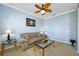 Relaxing living room with a soft couch, tables, and natural light creating a cozy space at 12442 Curry Dr, Spring Hill, FL 34609