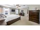Comfortable main bedroom featuring a king-size bed, ceiling fan, and lots of closet space at 12442 Curry Dr, Spring Hill, FL 34609