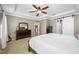 Inviting main bedroom offers ample space, a tray ceiling, and well-appointed furnishings at 12442 Curry Dr, Spring Hill, FL 34609