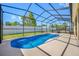 Enjoy this in-ground screened pool with an adjacent jacuzzi, perfect for relaxation and outdoor entertaining at 12442 Curry Dr, Spring Hill, FL 34609
