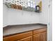 A photo of a storage area featuring ample counter space and cabinetry, with neatly organized rolls of paper towels on the shelf at 12442 Curry Dr, Spring Hill, FL 34609