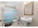 Cozy bathroom with pedestal sink and shower featuring simple, clean design at 12929 Prestwick Dr, Riverview, FL 33579