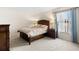 Cozy bedroom with a queen bed, warm lighting, and a serene atmosphere, perfect for relaxation and rest at 12929 Prestwick Dr, Riverview, FL 33579