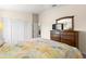 Bedroom featuring a dresser, neutral colors, and ample closet space, perfect for storage and organization at 12929 Prestwick Dr, Riverview, FL 33579