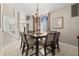 Elegant dining room showcasing a wooden table with seating for eight and a decorative chandelier at 12929 Prestwick Dr, Riverview, FL 33579