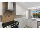 Contemporary kitchen with updated appliances, light countertops, and stylish backsplash at 12929 Prestwick Dr, Riverview, FL 33579