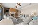 Cozy living room with a fireplace, built-in shelving, plush seating, and ample natural light at 12929 Prestwick Dr, Riverview, FL 33579
