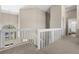 Upstairs loft overlooking the living area, showcasing white railings and abundant natural light at 12929 Prestwick Dr, Riverview, FL 33579