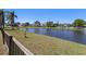 Scenic pond view with lush green landscaping and neighboring homes across the water at 12929 Prestwick Dr, Riverview, FL 33579
