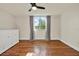 This is a bright bedroom with hardwood floors, a ceiling fan and lots of sunlight at 1301 S Howard Ave # B24, Tampa, FL 33606