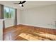 Bright bedroom features hardwood floors, ceiling fan and a large window providing lots of natural light at 1301 S Howard Ave # B24, Tampa, FL 33606