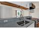 Well-lit kitchen with a stylish faucet and a view to a cozy bedroom at 1301 S Howard Ave # B24, Tampa, FL 33606