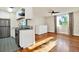 Modern kitchen with stainless steel appliances adjacent to a sunny living area at 1301 S Howard Ave # B24, Tampa, FL 33606