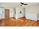 Bright living room with hardwood floors, ceiling fan, and natural light from a window at 1301 S Howard Ave # B24, Tampa, FL 33606