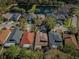 An aerial view shows neighborhood homes and surrounding pond at 15925 Pond Rush Ct, Land O Lakes, FL 34638