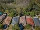 Aerial view showcases the neighborhood homes backing up to a wooded area at 15925 Pond Rush Ct, Land O Lakes, FL 34638