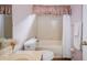 Bathroom featuring a tub, shower with a white shower curtain and vanity at 15925 Pond Rush Ct, Land O Lakes, FL 34638