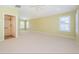 Spacious bedroom with great natural light and ceiling fan features ensuite bathroom at 15925 Pond Rush Ct, Land O Lakes, FL 34638