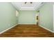 Spacious bedroom with wood floors, neutral walls and plenty of natural light at 15925 Pond Rush Ct, Land O Lakes, FL 34638