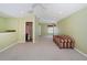 Spacious carpeted bonus room with natural light, recessed lights, and bathroom entrance at 15925 Pond Rush Ct, Land O Lakes, FL 34638