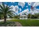 A community park gazebo and flag offer a tranquil outdoor space amidst lush greenery at 15925 Pond Rush Ct, Land O Lakes, FL 34638