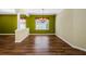 Dining room features hardwood floors and neutral colors at 15925 Pond Rush Ct, Land O Lakes, FL 34638