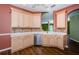 Spacious kitchen featuring wooden cabinets, stainless steel appliances, and wood flooring at 15925 Pond Rush Ct, Land O Lakes, FL 34638