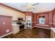Cozy kitchen with stainless steel appliances, tile backsplash, and adjacent dining area at 15925 Pond Rush Ct, Land O Lakes, FL 34638