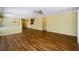 Spacious living room features laminate floors, neutral paint and arched doorways at 15925 Pond Rush Ct, Land O Lakes, FL 34638