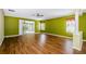 Large living room with sliding glass doors to a screened lanai, and crown molding at 15925 Pond Rush Ct, Land O Lakes, FL 34638