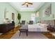 Stylishly furnished main bedroom featuring a ceiling fan and ample natural light at 15925 Pond Rush Ct, Land O Lakes, FL 34638